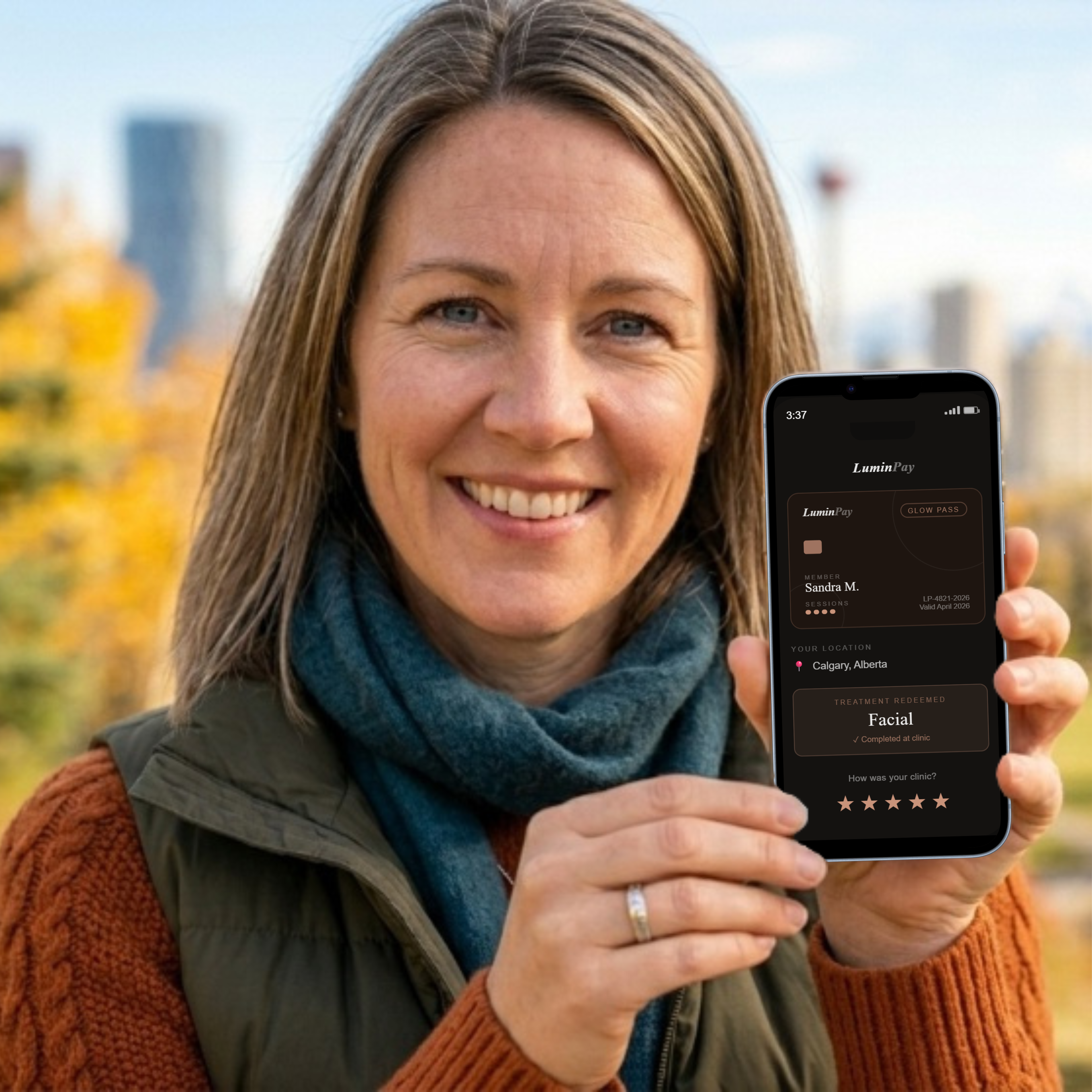 Sandra holding the LuminPay pass on her phone